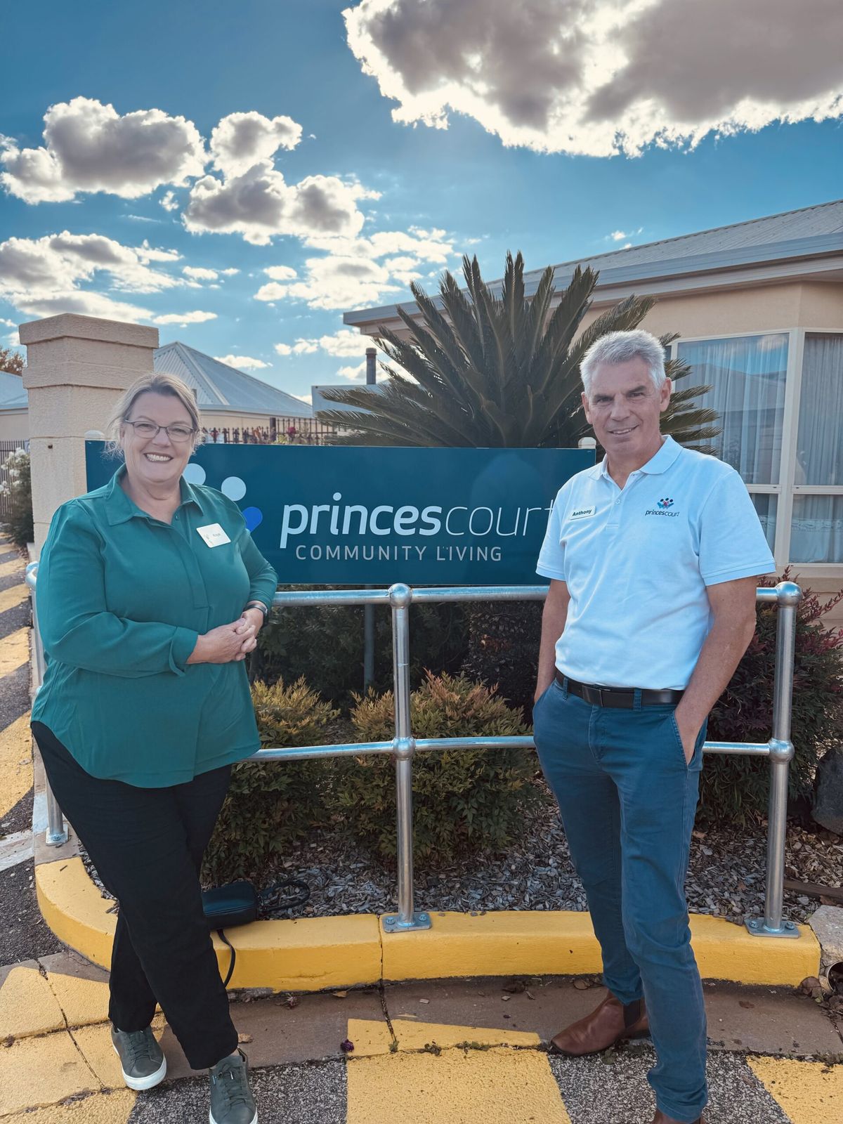 Kaye Matthews and CEO Anthony Couroupis standing outside Princes Court